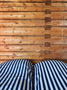 Three of the rooms have log wall in sight.